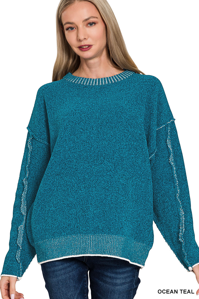 Exposed seam sweater